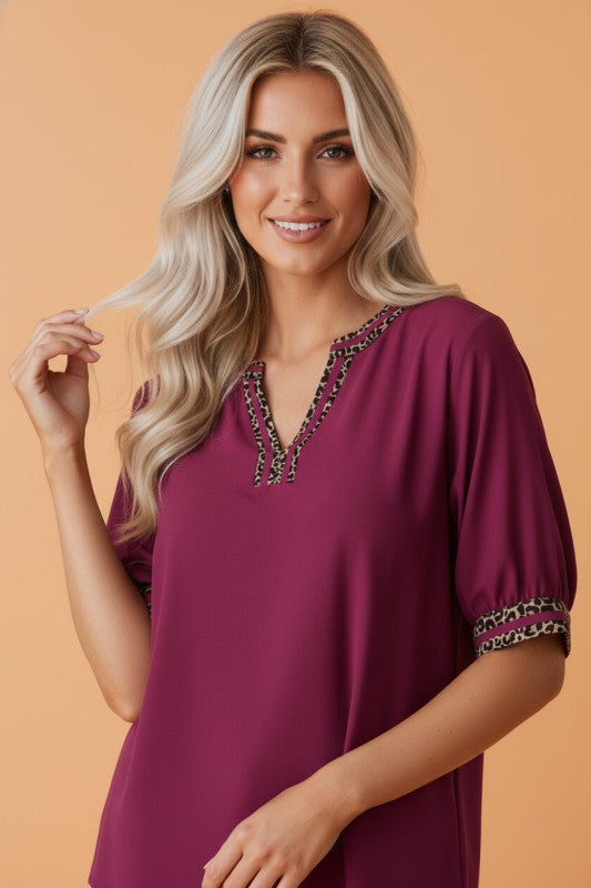 leopard trim blouse, V-neck short sleeve top, animal print accent shirt, women's boutique tops, lightweight summer blouse, chic animal print fashion, berry leopard blouse, polyester V-neck top