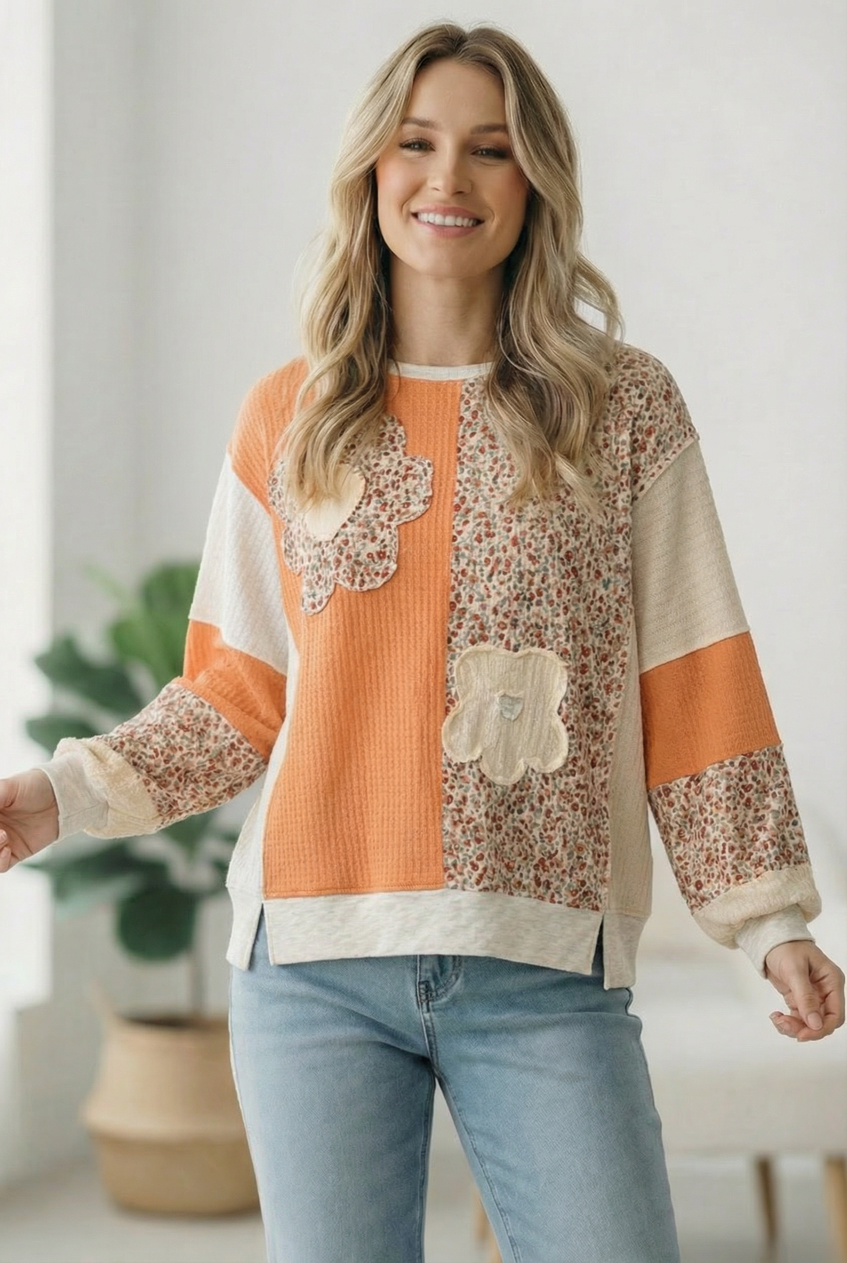 orange colorblock top, floral patchwork pullover, women’s bubble sleeve knit, boho floral sweater, orange creamsicle top, textured knit pullover, feminine spring fashion, boutique floral top