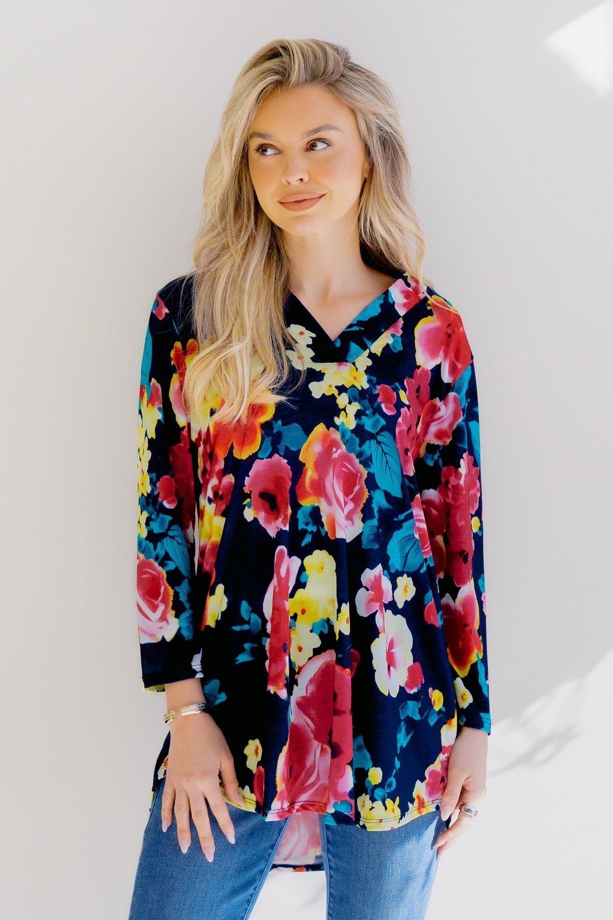 A floral top in navy and multi-color with a v-neck and three-quarter sleeves.
