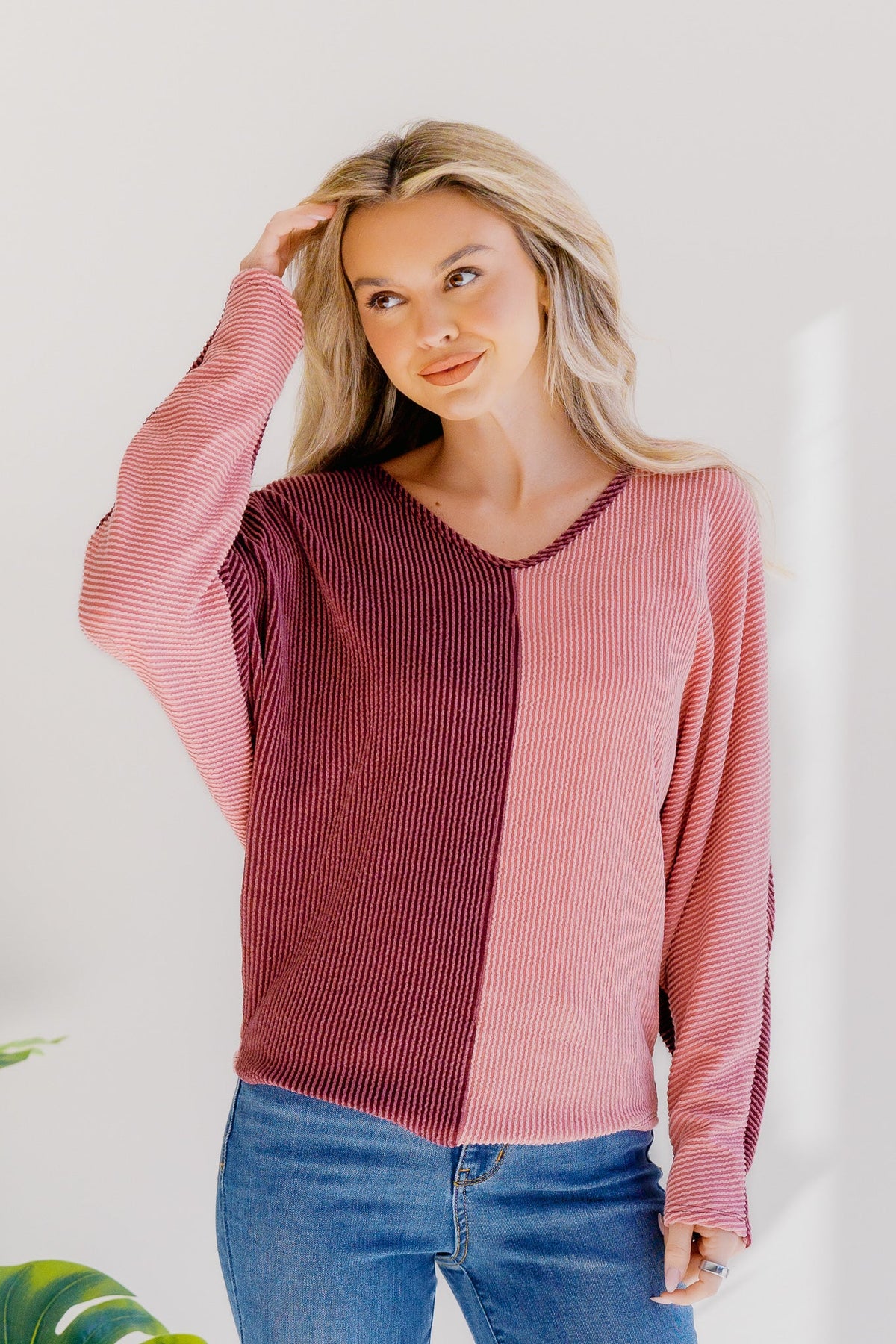 Dusky Rose Duo Top with a v-neck design, featuring burgundy and mauve color block with long sleeves.