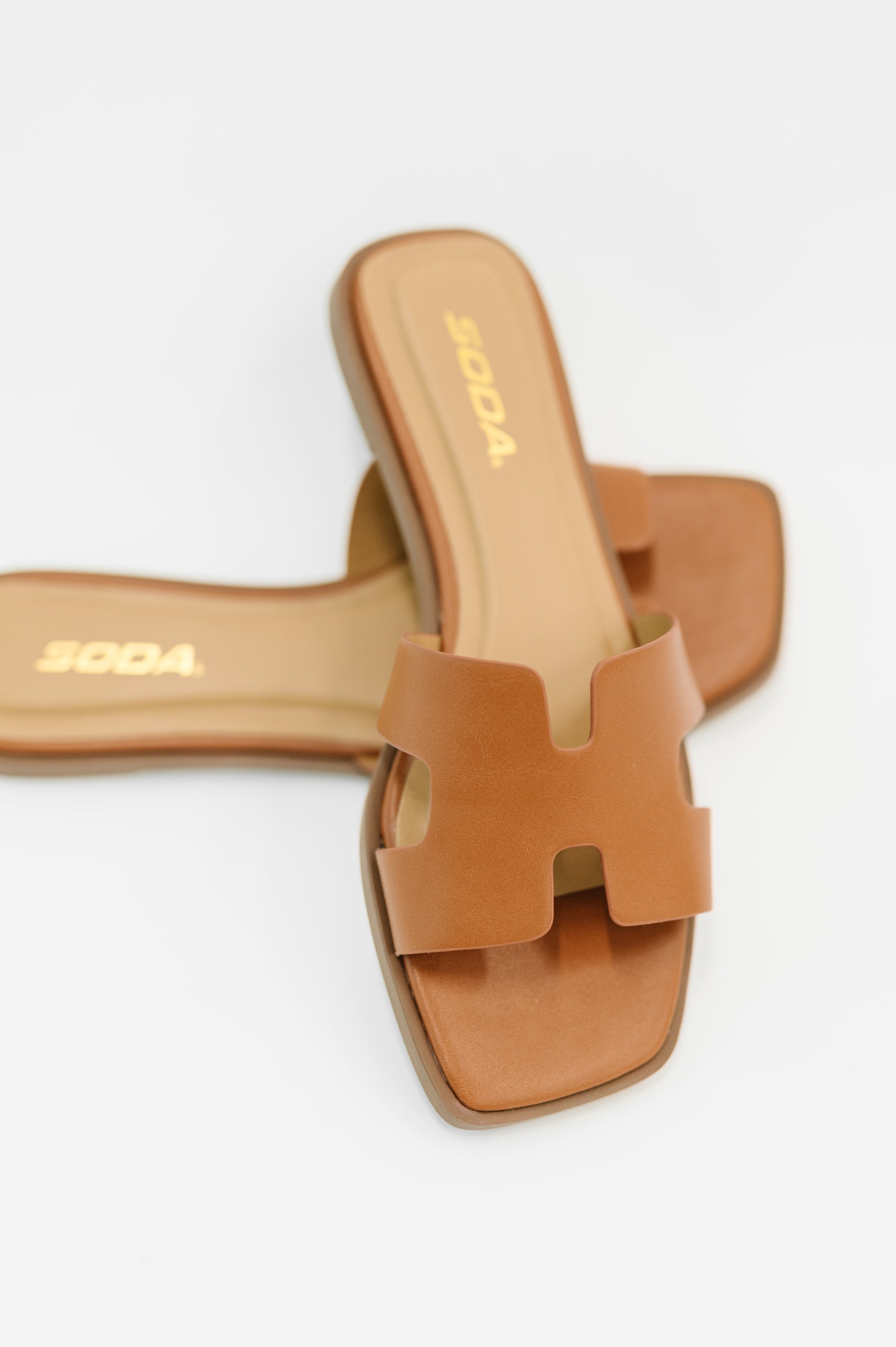 Cognac slide sandals, square toe slides, cutout strap sandals, minimalist summer footwear, PU leather slip-ons, Soda sandals, cognac flat sandals, chic casual footwear.
