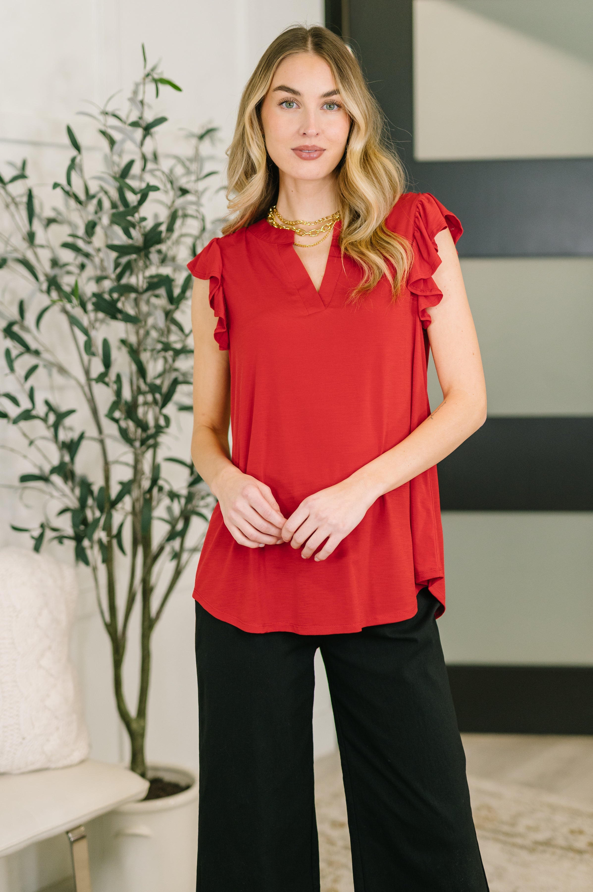 Red blouse, flutter sleeve top, women’s v-neck shirt, hi-low hem blouse, boutique red top, professional women's tops, soft stretch blouse, red summer fashion.