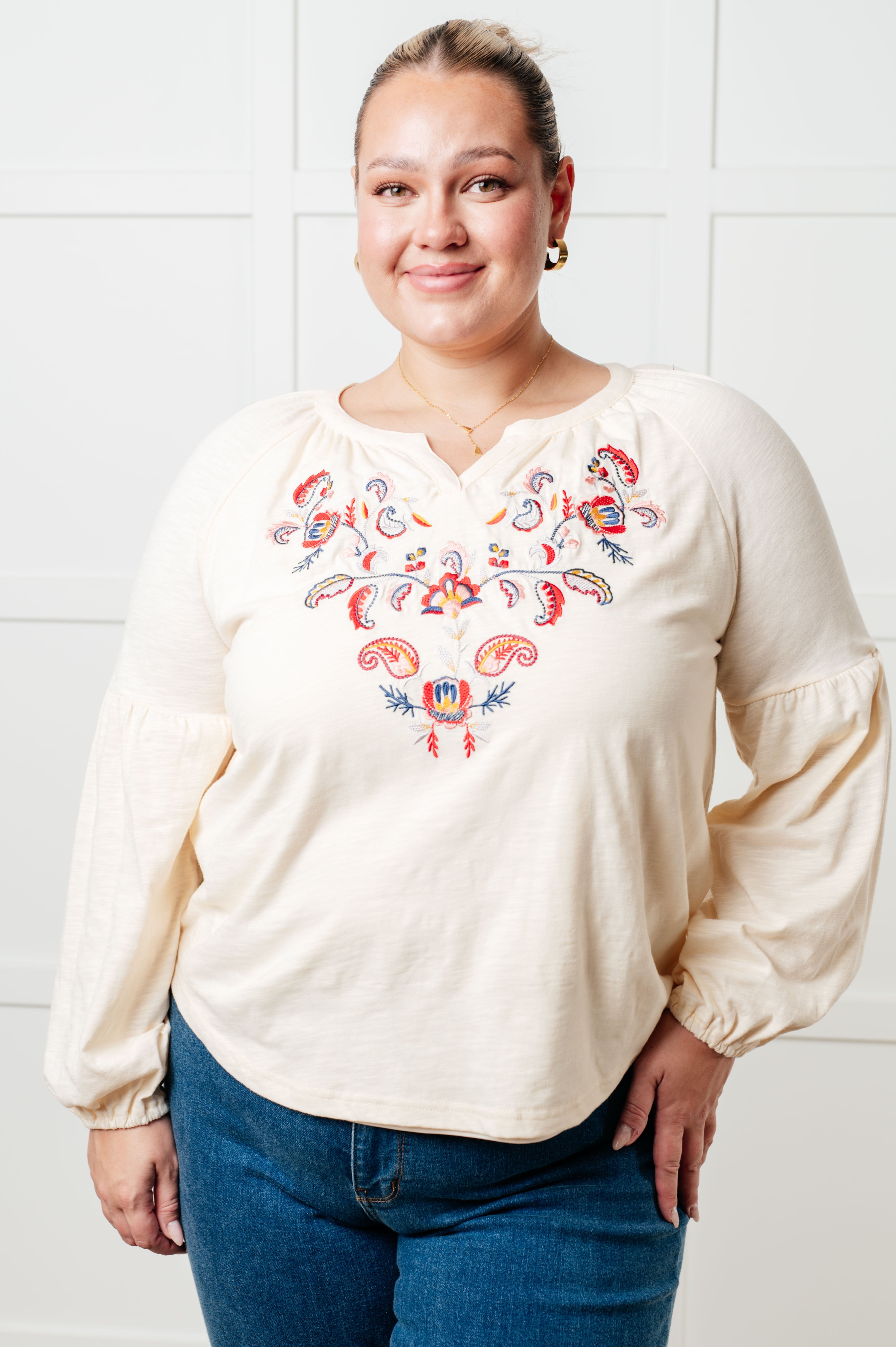 Shop our Floral Embroidered Boho Blouse! Featuring soft jersey knit, bishop sleeves, and intricate floral details. Perfect for festive style and premium comfort.