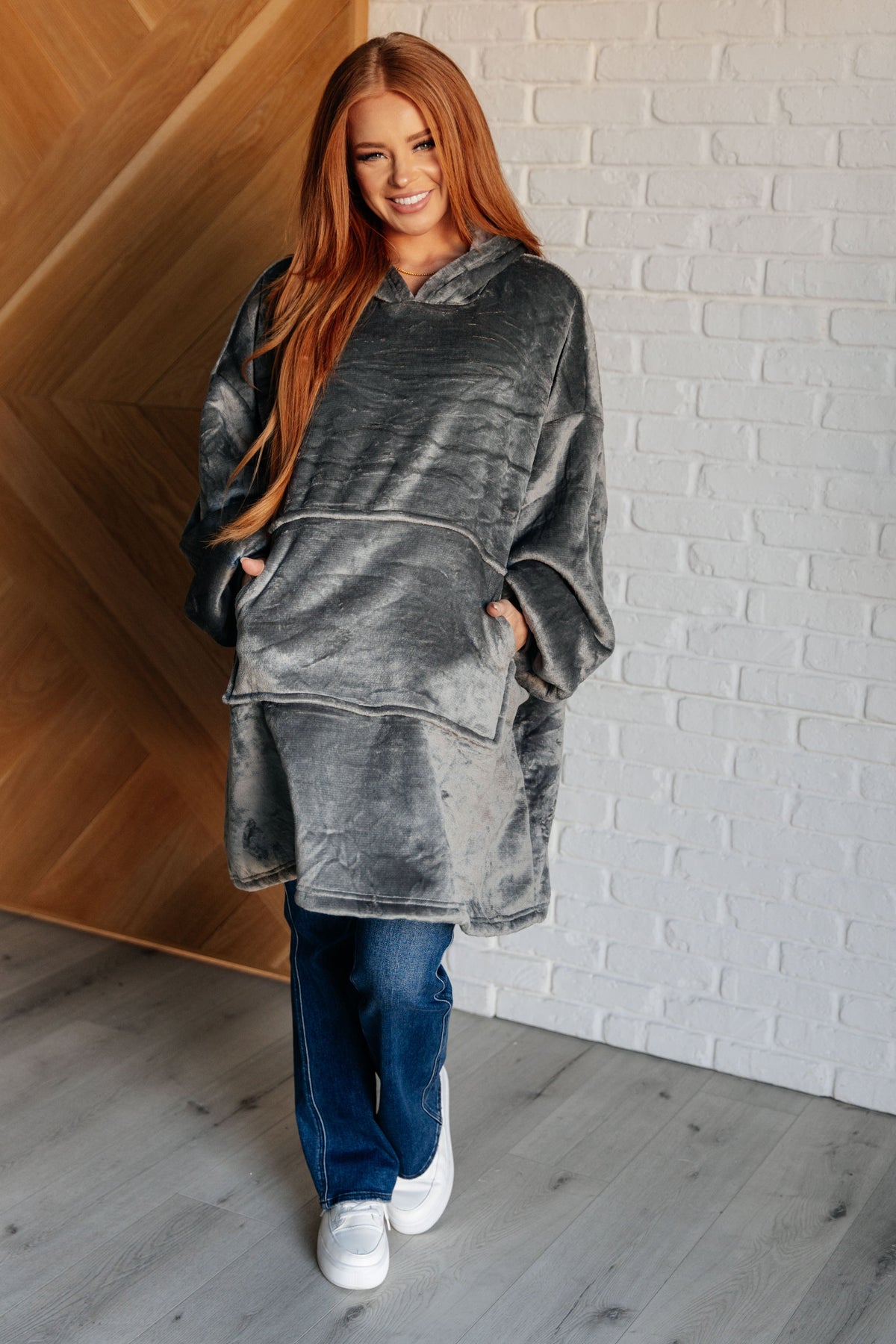 Gray oversized velour blanket hoodie with sherpa lining, featuring a hooded neckline and spacious fit.