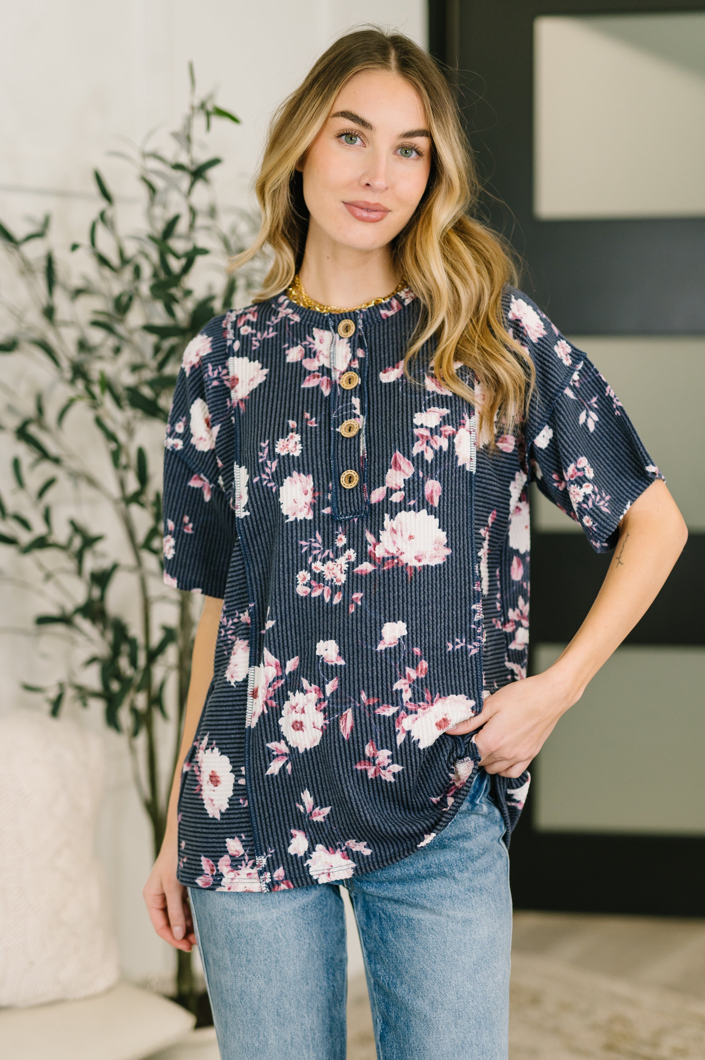 floral henley top, cable ribbed knit, women's short sleeve henley, navy floral shirt, high stretch top, casual boho style, exposed seam detail, feminine floral blouse