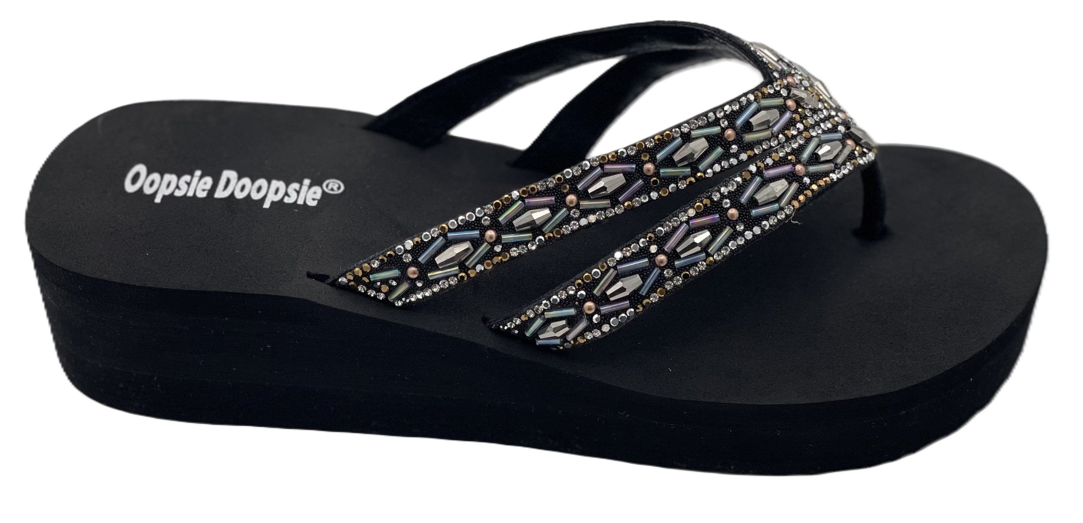 Black sandal with decorative strap on white background