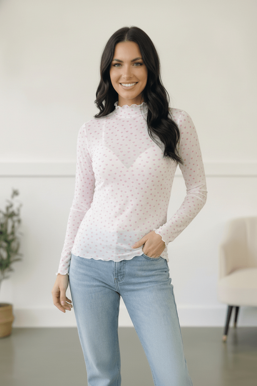 sheer mesh top, pink heart print shirt, lettuce edge mesh top, Valentine’s Day outfit ideas, long sleeve sheer layering top, romantic mesh blouse, heart pattern top, women’s sheer turtleneck, flirty mesh top, Fabknits sweetheart top.