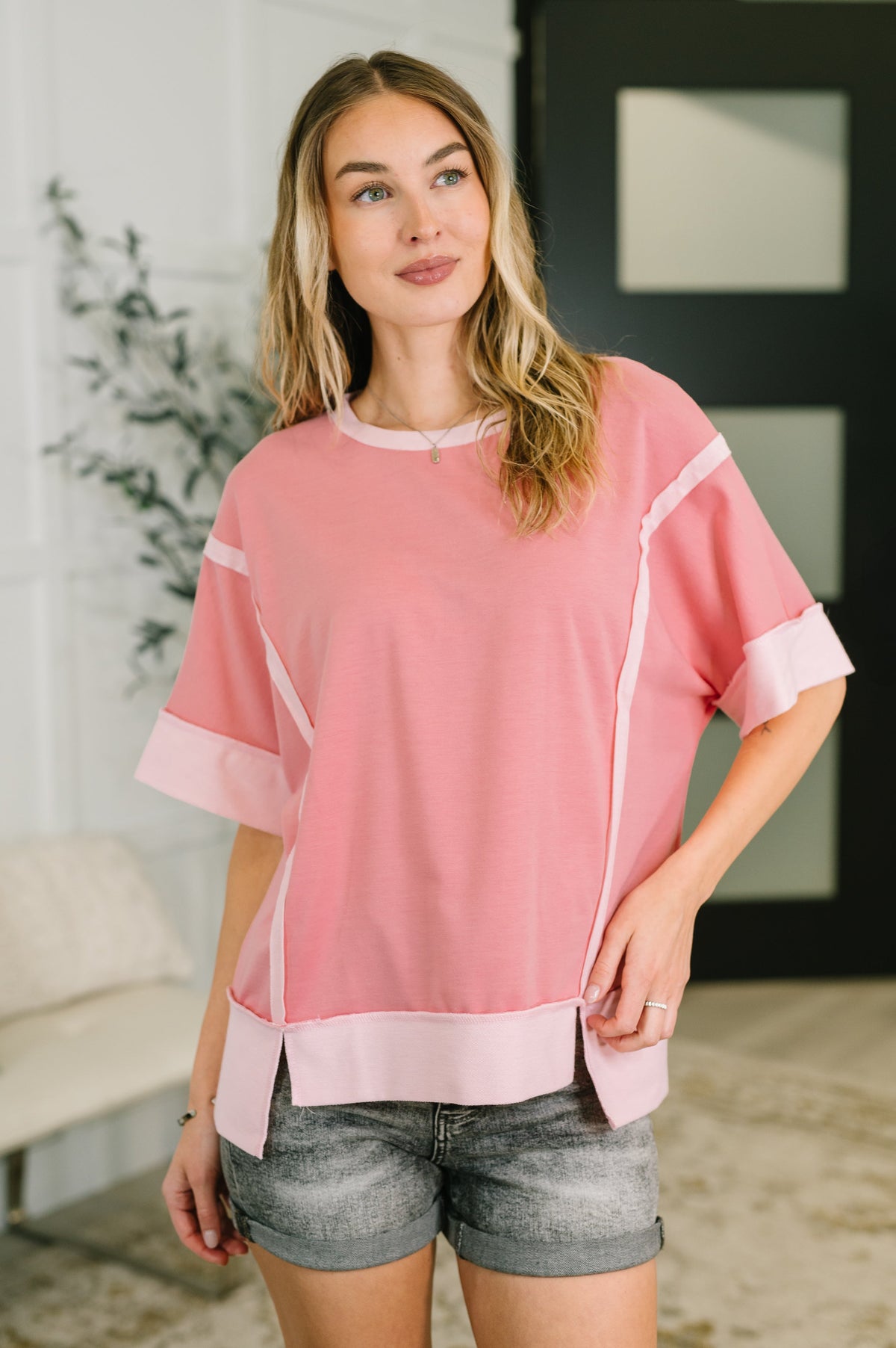 pink french terry top, exposed seam shirt, women’s casual pink top, drop shoulder lounge top, high low hem top, comfortable pink sweatshirt, boutique casual wear