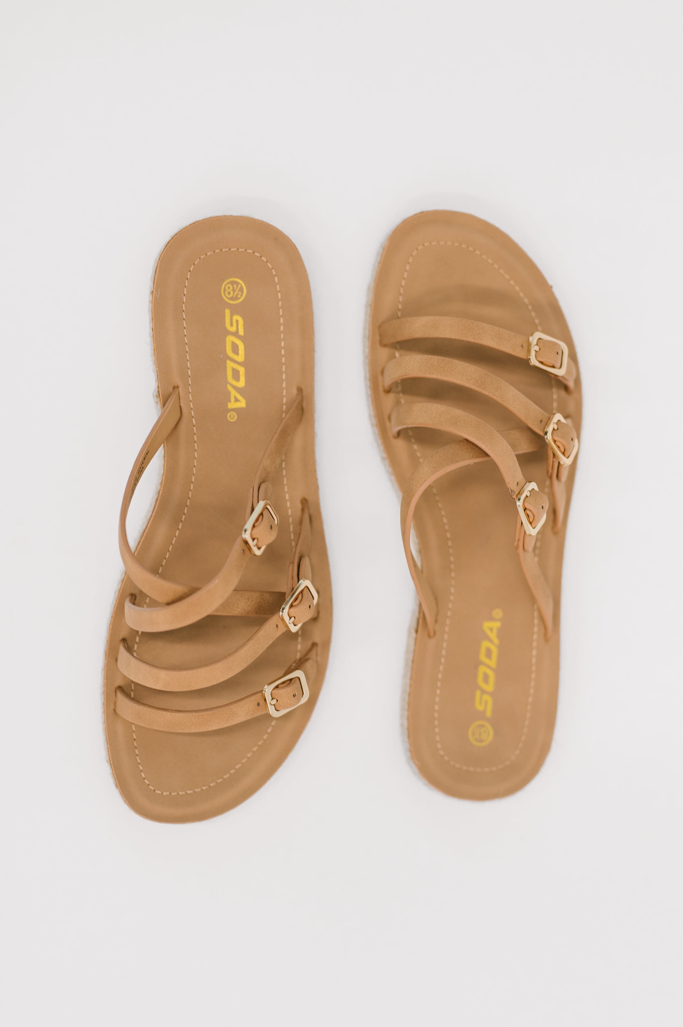 strappy sandals, tan flat sandals, women's summer shoes, gold buckle sandals, beach footwear, comfortable slip-on sandals, boho chic sandals, light tan footwear