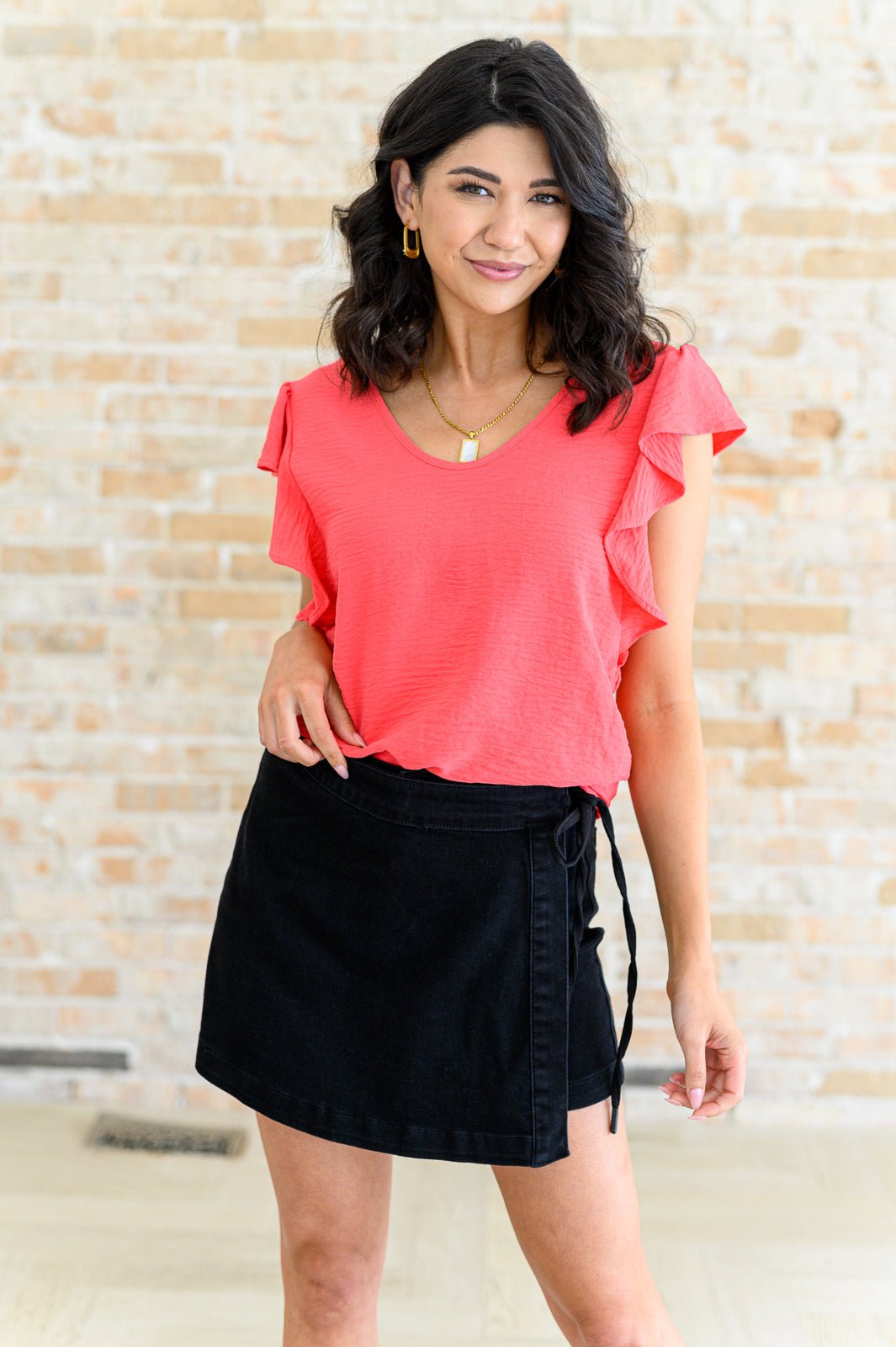 Flutter sleeve top, crinkle woven blouse, V-neck ruffle top, women's coral blouse, adjustable back tie top, summer flutter sleeve shirt, feminine polyester top, boutique fashion tops.