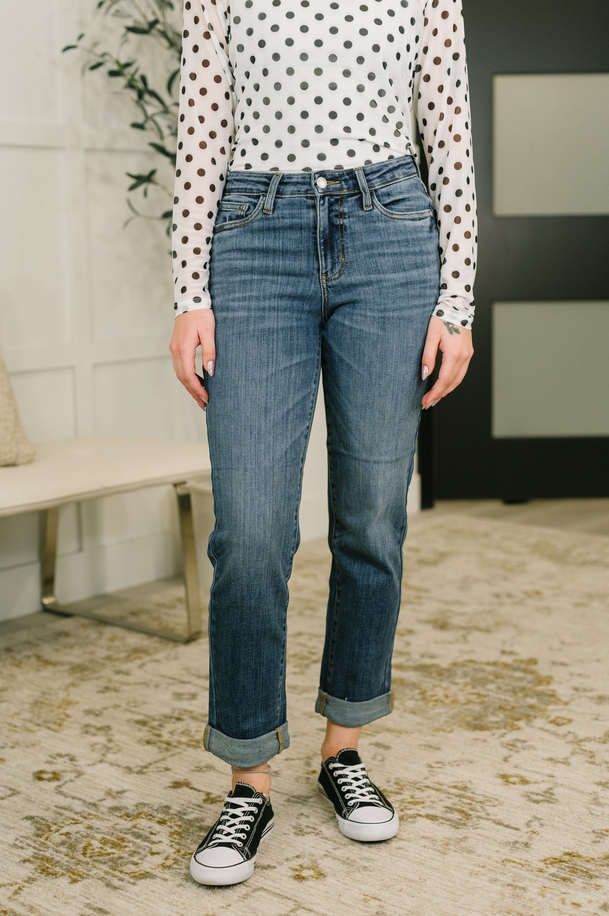 Mid-rise boyfriend jeans in dark indigo with a relaxed fit and cuffed hem.