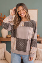 patchwork sweatshirt, mixed print pullover, floral boho top, oversized sweatshirt, women’s boutique tops, cottagecore aesthetic, cozy loungewear, exposed seam sweater, polka dot sweatshirt