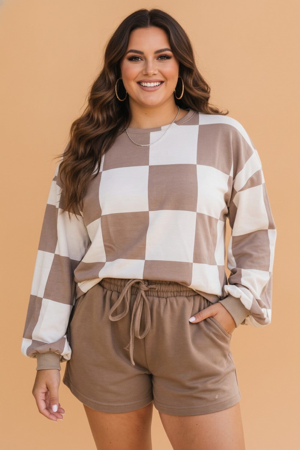 Plus size matching set, checkered lounge set, women's sporty co-ord, curve racing style, plus size athleisure, checkered long sleeve top, drawstring shorts set, trendy plus size fashion.