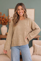 Taupe knit sweater, boxy pullover, lightweight fall sweater, women's pocket sweater, relaxed fit knitwear, warm taupe top, effortless autumn style.