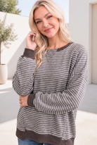 Relaxed raglan pullover with mocha and cream stripes, featuring ribbed cuffs and a casual fit.