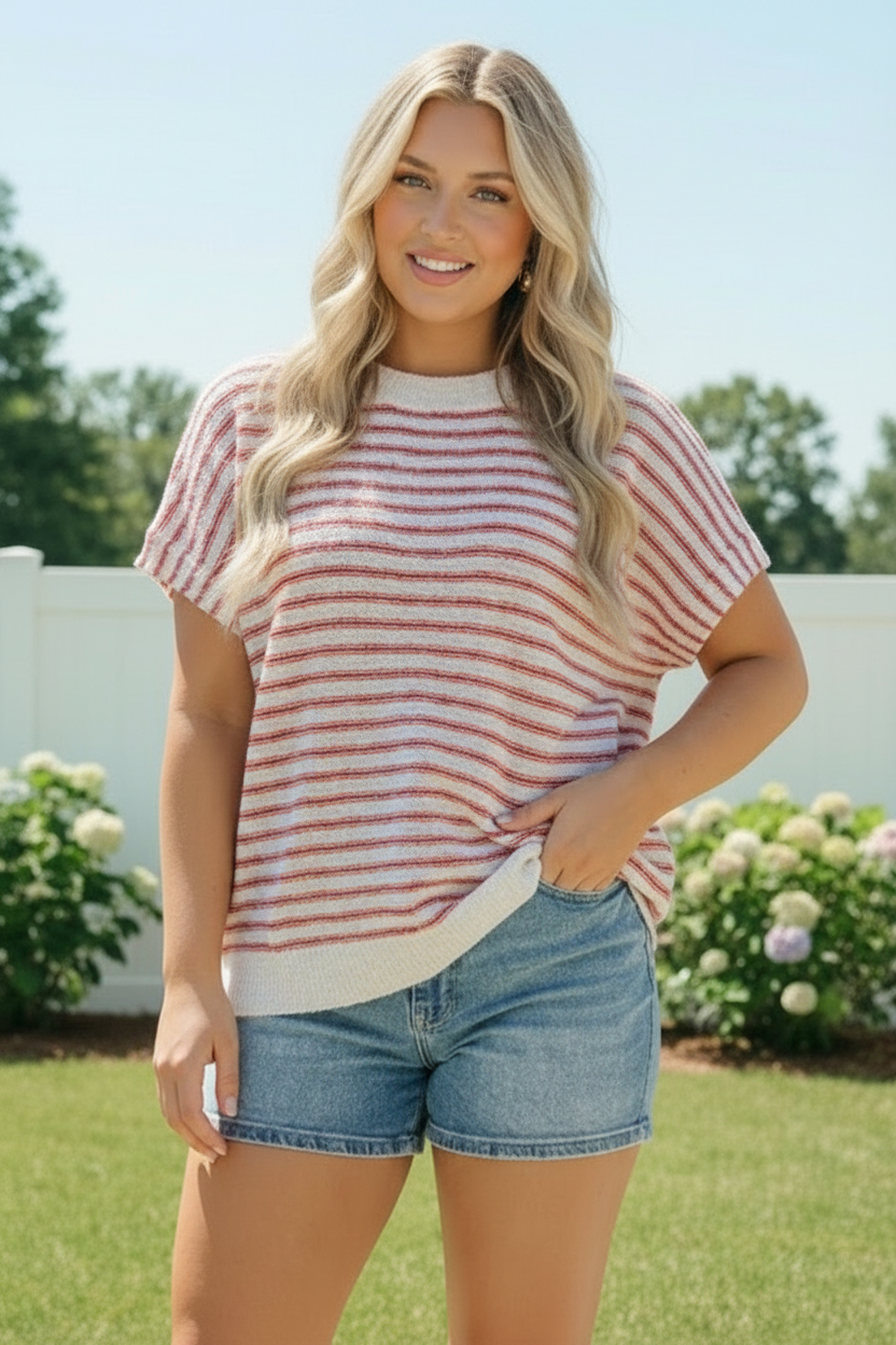 Striped knit top, boxy sweater, women's transitional fashion, red and ivory stripe, dolman sleeve top, relaxed fit knitwear, casual brunch outfit, lightweight knit top.