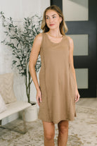 Mocha-colored scoop neck tank dress with sleeveless design and exposed seam details.