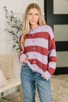 Purple and red striped button-down sweater with a drop shoulder design.