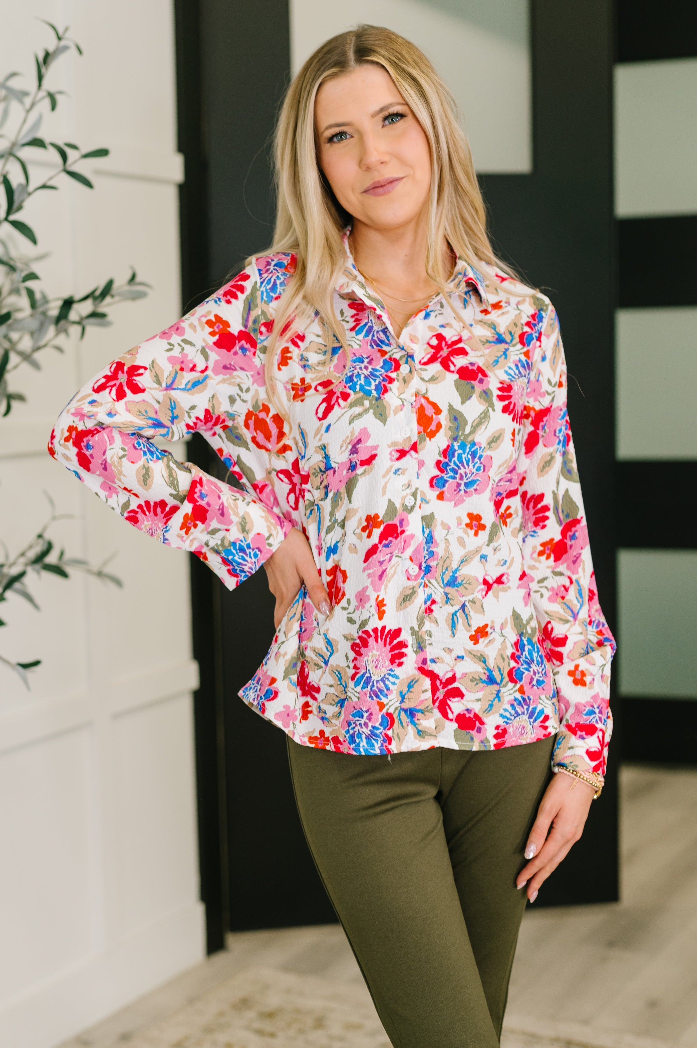 A floral button-down shirt with a classic collar and banded cuffs, showcasing a vibrant multicolor floral pattern.