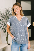 Polka dot top, French terry V-neck, casual women's top, relaxed fit blouse, dolman sleeve shirt, comfortable loungewear, contrast trim top, stylish casual wear, soft stretch top.