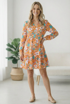 Tangerine floral dress, orange long sleeve mini, tiered floral dress, split neck mini dress, boho floral dress, vibrant women's boutique dress, spring floral fashion.