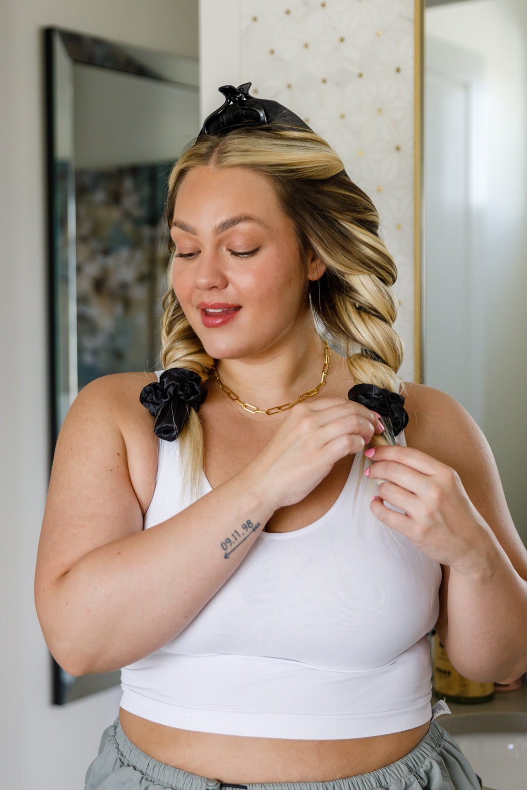Woman using heatless hair curlers.