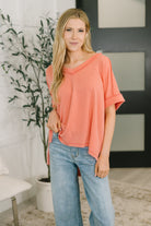 Coral V-neck tee, ribbed knit top, cable knit shirt, relaxed fit women’s top, dolman sleeve tee, casual chic apparel, hi-lo hem shirt, women's coral fashion.