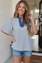 striped flutter sleeve top, blue and white stripe blouse, women's chambray trim top, casual summer blouse, relaxed fit woven top, breezy vertical stripe shirt, boutique tops for women