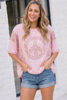 Pink graphic tee, floral peace sign shirt, oversized boho top, lace trim t-shirt, women's pink oversized tee, 100% cotton graphic tee, floral contrast sleeve top, boho-chic brunch outfit.