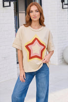 oversized graphic tee, retro star t-shirt, women's beige tee, relaxed fit top, cotton blend t-shirt, vintage style star shirt, streetwear aesthetic, casual brunch outfit, layered sleeve tee