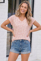 Rose leopard print, pink animal print top, women's V-neck tee, boutique fashion, pink leopard t-shirt, casual cap sleeve top, Wild at Heart tee, summer animal print, soft relaxed top.