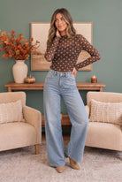 Sheer mesh top, polka dot mock neck, brown long sleeve layering, women's transitional fashion, sheer polka dot shirt, mesh layering top, brown and cream mesh top.