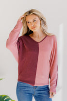 Dusky Rose Duo Top with a v-neck design, featuring burgundy and mauve color block with long sleeves.