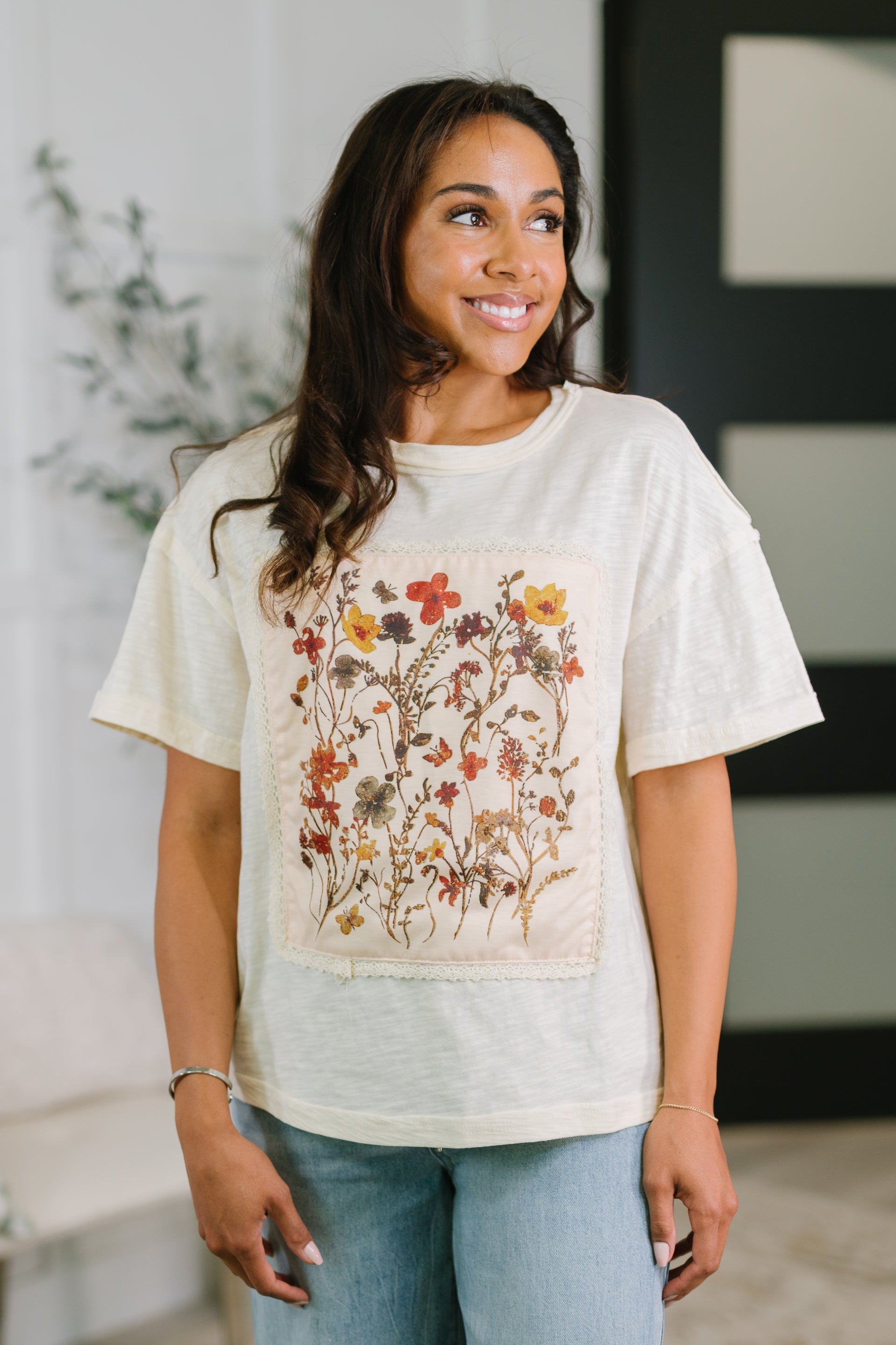 floral applique top, 100% cotton tee, vintage style shirt, lace trim top, heathered knit top, boho floral graphic tee, women's drop shoulder top, cotton casual top, vintage-inspired fashion.