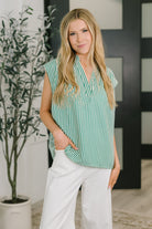 Sleeveless blouse, green striped top, v-neck blouse, crinkle woven top, women's polished tops, hi-low hem blouse, workwear fashion, summer sleeveless top, structured blouse.