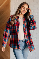 A multicolor plaid button-up shirt with a collared neckline and relaxed fit.