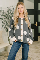 Button-down cardigan with a round neckline and front patch pockets.