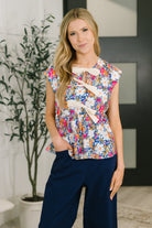 Floral peplum top, bow detail blouse, women's poplin top, floral sleeveless blouse, waist-defining top, feminine summer blouse, Mrs. Dependable top, boutique floral tops.