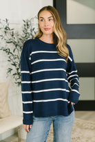 Navy drop shoulder casual top with ribbed round neckline and cuffs, worn by a model.