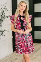 fuchsia pink dress, abstract print dress, bow detail dress, flutter sleeve dress, women's A-line dress, summer occasion dress, boutique dress with pockets, playful fuchsia fashion