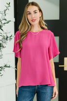 Pink blouse, plisse sleeve top, ruffle sleeve pink shirt, women's textured top, vibrant pink fashion, relaxed fit blouse, elegant casual wear.