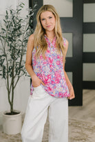 Floral sleeveless top, wrinkle-resistant blouse, Bulgari fabric clothing, women's cooling shirt, travel-friendly floral top, split neck sleeveless blouse, summer floral fashion, Sea Spray top.