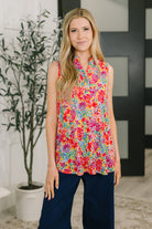 Sleeveless floral top, wrinkle-free blouse, collared tank top, women's island bloom shirt, summer floral fashion, high stretch top, Bulgari fabric shirt, travel-friendly clothing.