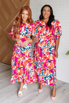 Floral midi dress, balloon sleeve dress, smocked back dress, wedding guest dress, vibrant summer dress, women's floral fashion, elegant garden party dress.