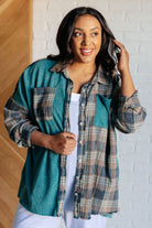 Thermal plaid button-up shirt with a mix of teal and beige flannel and waffle knit, featuring chest pockets and a raw hem.