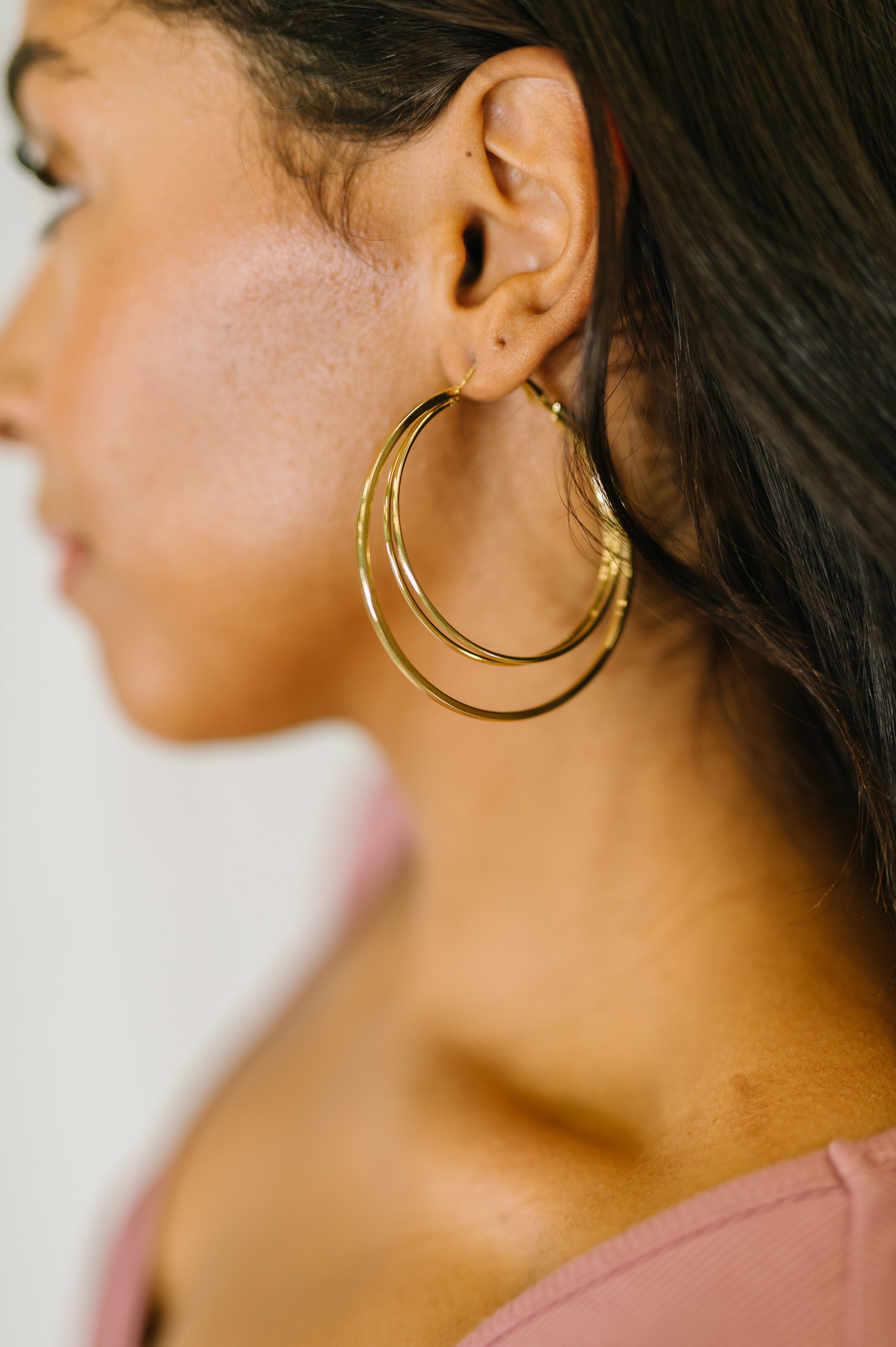 Gold double hoop earrings, layered hoop earrings, triple hoop gold earrings, geometric jewelry, statement gold earrings, comfortable hinge hoops, gold huggie hoops, modern gold jewelry.