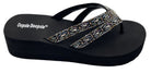 Black sandal with decorative strap on white background