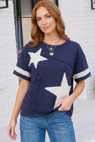 navy varsity tee, star applique shirt, cotton graphic tee, oversized navy top, sporty casual wear, women's varsity t-shirt, raw edge cotton tee, boho sporty style