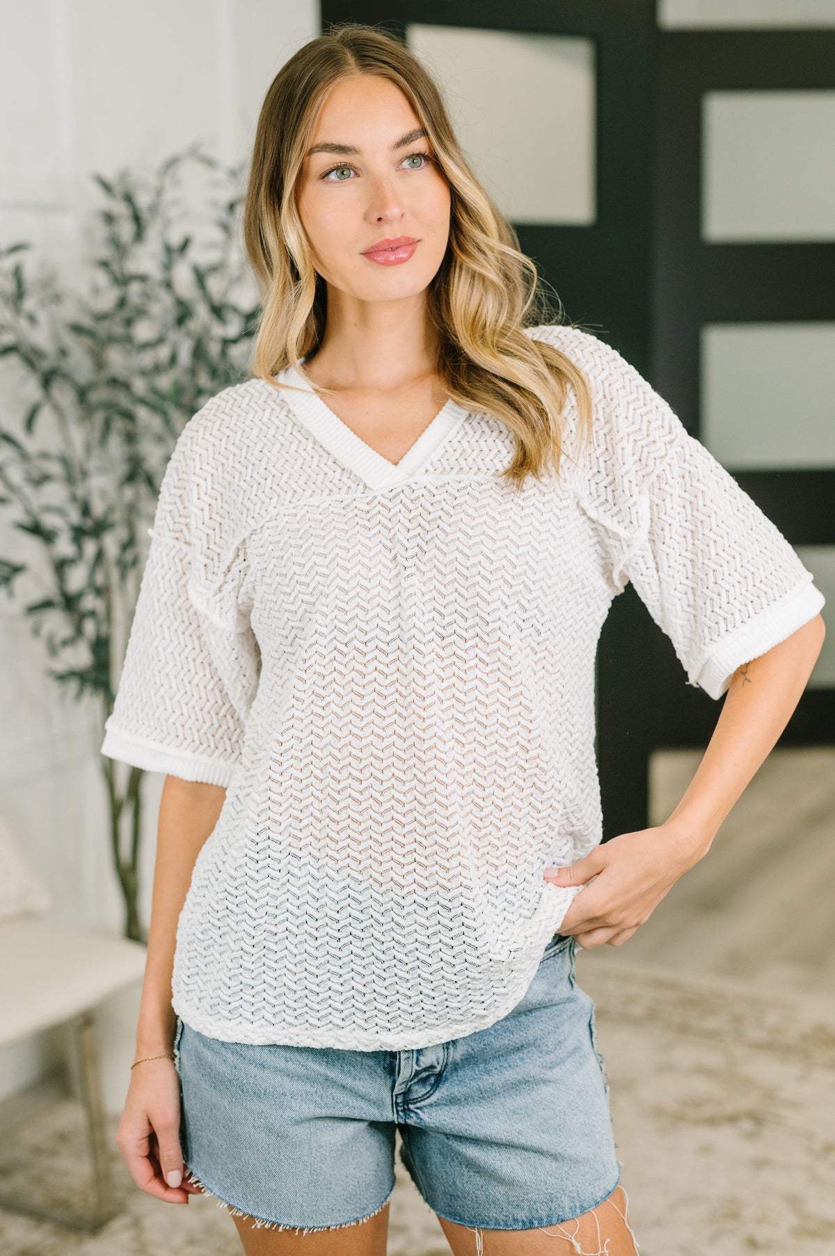 textured knit top, sheer oversized shirt, women’s V-neck knit, relaxed fit top, drop shoulder sweater, exposed seam fashion, summer layering top, white textured top, cable rib knit