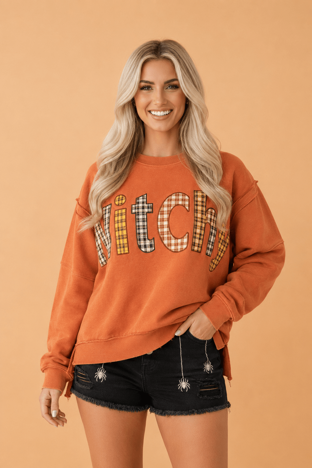 Halloween sweatshirt, witchy aesthetic clothing, plaid patchwork top, exposed seam sweatshirt, burnt orange autumn sweater, spooky season apparel, women's fall fashion.